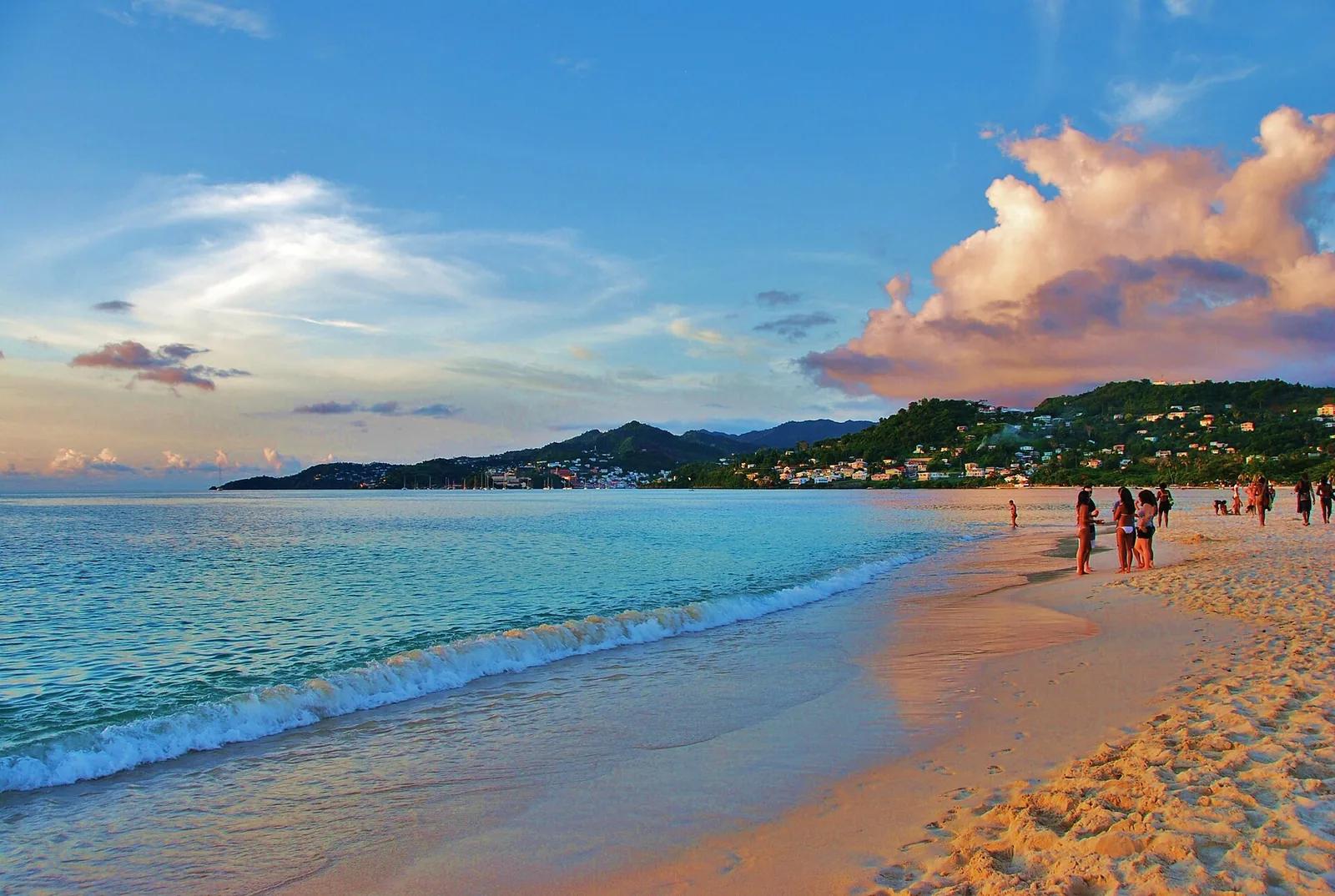 Grand Anse beach in Grenada, its curve of sand running toward the town on the headland